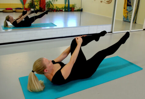 Woman doing Pilates exercise