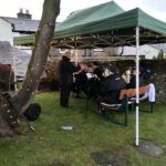 Brass band playing carols in the garden of The Pheasant