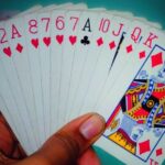 playing cards in a hand