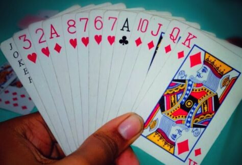 playing cards in a hand