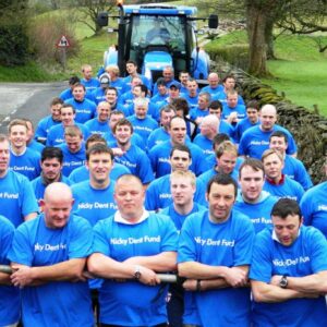 Voulnteers pulling a tractor from Sedbergh to Kendal